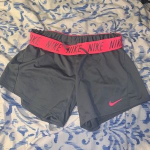 Pink and grey Nike shorts